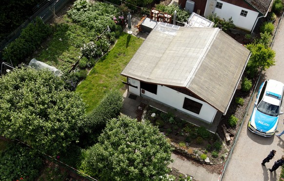 epa08469420 An aerial picture taken by a drone shows an arbour where four men were accused of sexually abusing a five and a ten years old boys at allotment garden in Muenster, Germany, 06 June 2020. F ...