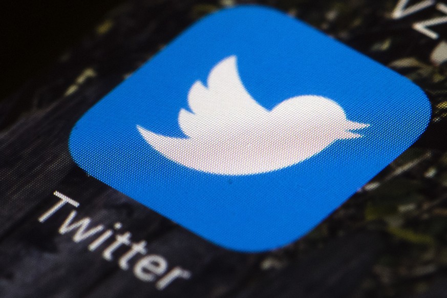 FILE - This April 26, 2017, file photo shows the Twitter app icon on a mobile phone in Philadelphia. Twitter says an elected Dutch official was among 36 account holders whose direct message inboxes we ...