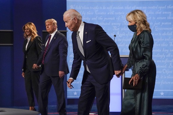 First lady Melania Trump, from left, President Donald Trump, Democratic presidential candidate former Vice President Joe Biden and Jill Biden stand on stage after the first presidential debate at Case ...