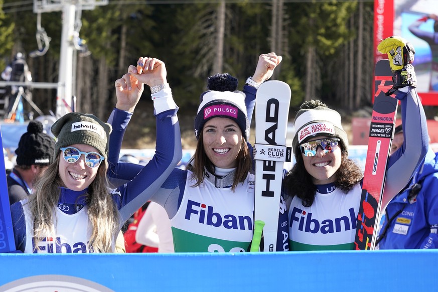 Italy&#039;s Elena Curtoni, center, winner of the alpine ski women&#039;s World Cup downhill, celebrates with second placed Italy&#039;s Marta Bassino, left, and third placed Italy&#039;s Federica Bri ...