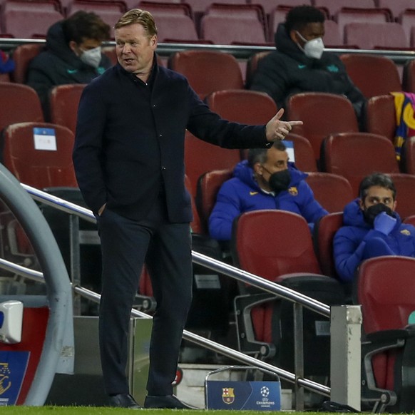 Barcelona&#039;s head coach Ronald Koeman gestures during the Champions League round of 16, first leg soccer match between FC Barcelona and Paris Saint-Germain at the Camp Nou stadium in Barcelona, Sp ...