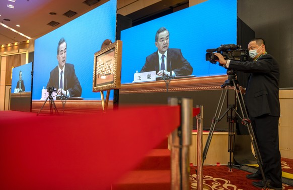 Chinese Foreign Minister Wang Yi speaks during a remote video press conference held on the sidelines of the annual meeting of China&#039;s National People&#039;s Congress (NPC) in Beijing, Sunday, Mar ...