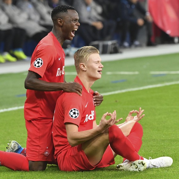 Salzburg&#039;s Erling Braut Haaland, right, celebrates with his teammate Salzburg&#039;s Patson Daka after scoring the opening goal during the Champions League Group E soccer match between FC Red Bul ...