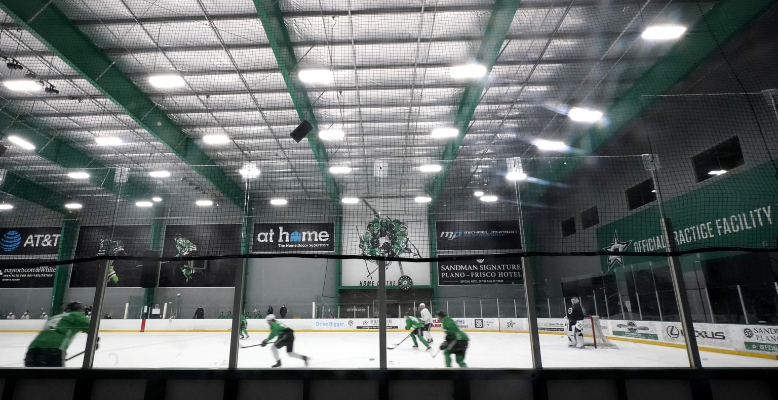 The Dallas Stars run drills during NHL hockey training camp practice Wednesday, Jan. 6, 2021, in Frisco, Texas. (AP Photo/LM Otero)