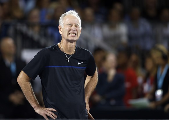 John McEnroe reacts after a point during a World Team Tennis exhibition to benefit the Elton John AIDS Foundation on Monday, Oct. 10, 2016, in Las Vegas. (AP Photo/Isaac Brekken)
