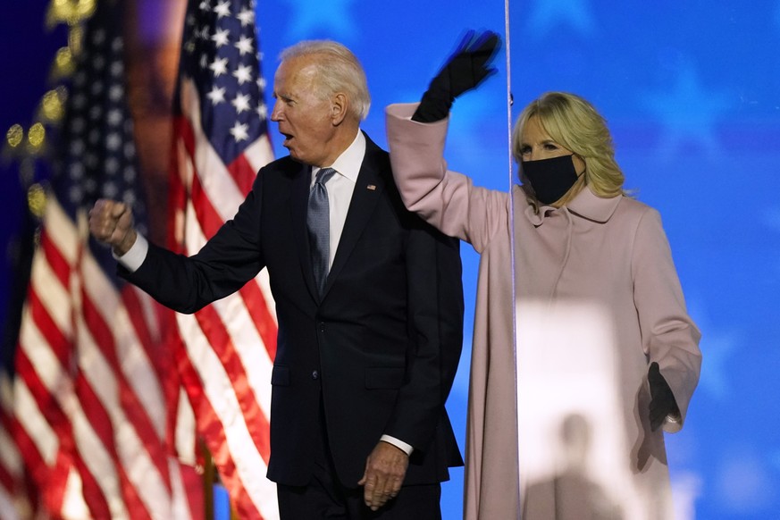 Democratic presidential candidate former Vice President Joe Biden and his wife Jill Biden wave to supporters, Tuesday, Nov. 3, 2020, in Wilmington, Del. (AP Photo/Andrew Harnik)
Joe Biden