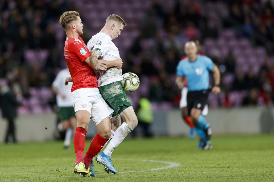 Switzerland&#039;s defender Nico Elvedi, left, fight for the ball with Ireland&#039;s midfielder James McClean, right, during the UEFA Euro 2020 qualifying Group D soccer match between Switzerland and ...
