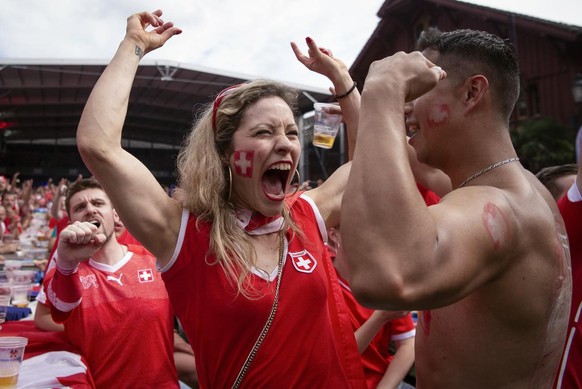 Swiss supporters react at a public viewing of the FIFA 2018 World Cup round of 16 soccer match between Switzerland and Sweden, in the fan zone &quot;Winti Arena&quot; in Winterthur, Switzerland, Tuesd ...