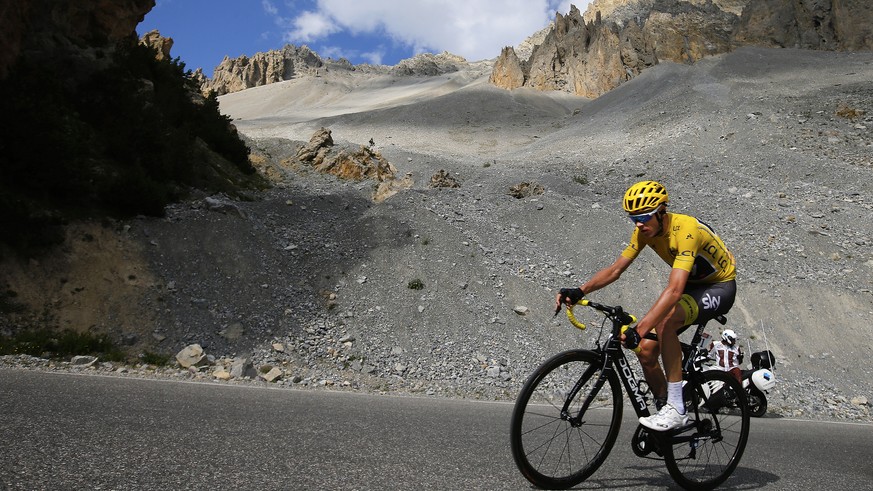 Britain&#039;s Chris Froome, wearing the overall leader&#039;s yellow jersey, climbs Izoard pass during the eighteenth stage of the Tour de France cycling race over 179.5 kilometers (111.5 miles) with ...