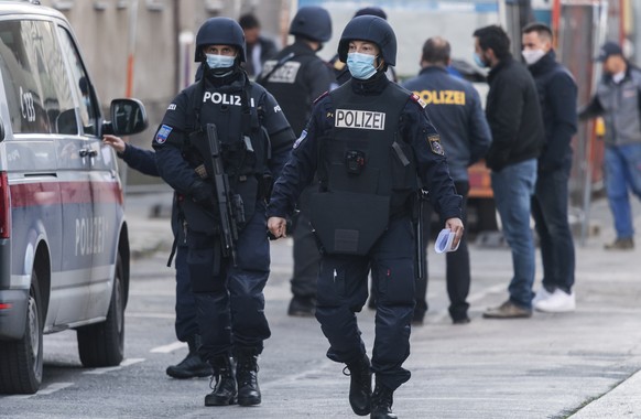 epa08802915 Armed Austrian police officers during a raid at a mosque in Vienna, Austria, 06 November 2020. According to reports, Austrian Interior Minister announced on 06 November the closure of all  ...