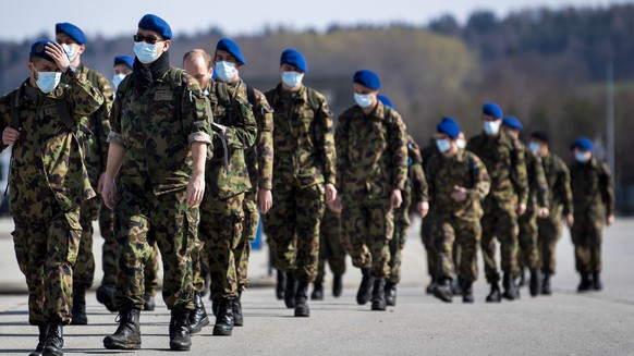 Soldiers from the Swiss Army &quot;Bataillon Hopital 2&quot; from &quot;Division territoriale 1&quot; walk as they practice health and medical exercises in the military camp before being deployed in s ...