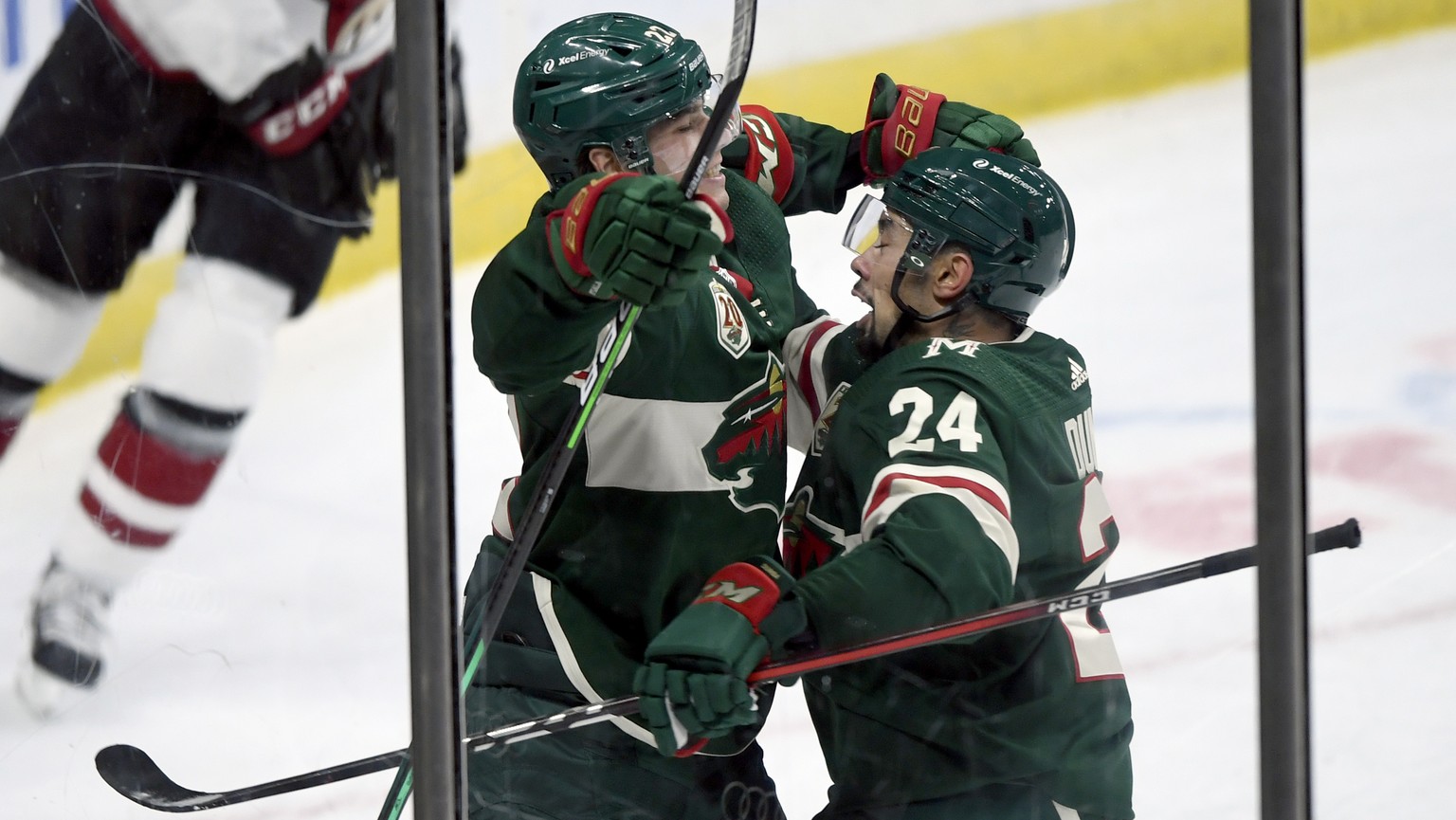 Minnesota Wild&#039;s Matt Dumba (24) congratulates teammate Kevin Fiala (22), of Switzerland, on his goal against the Arizona Coyotes during the third period of an NHL hockey game Sunday, March 14, 2 ...