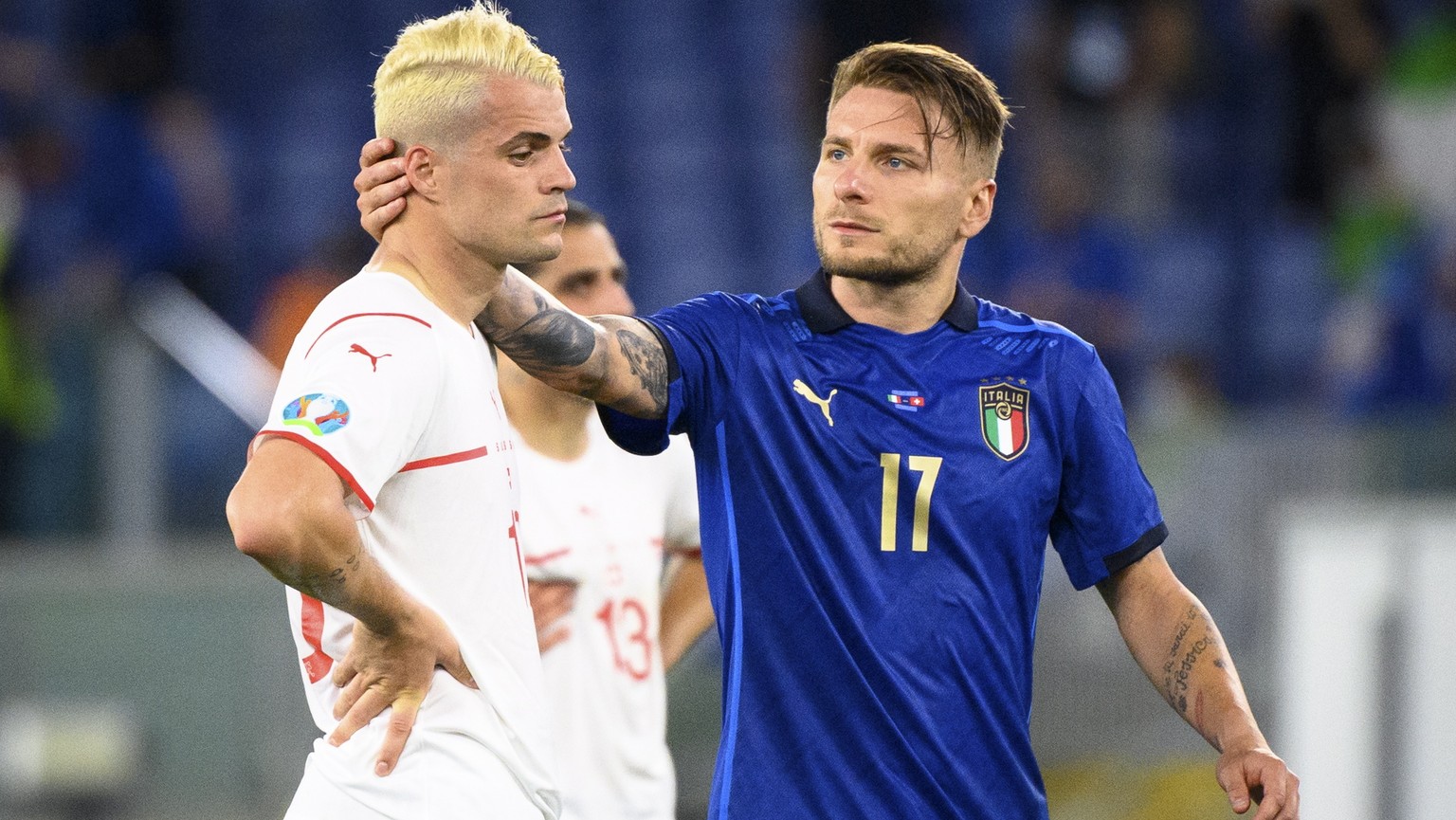 epaselect epa09278310 Italy&#039;s forward Ciro Immobile (R) comforts Switzerland&#039;s midfielder Granit Xhaka after the UEFA EURO 2020 group A preliminary round soccer match between Italy and Switz ...