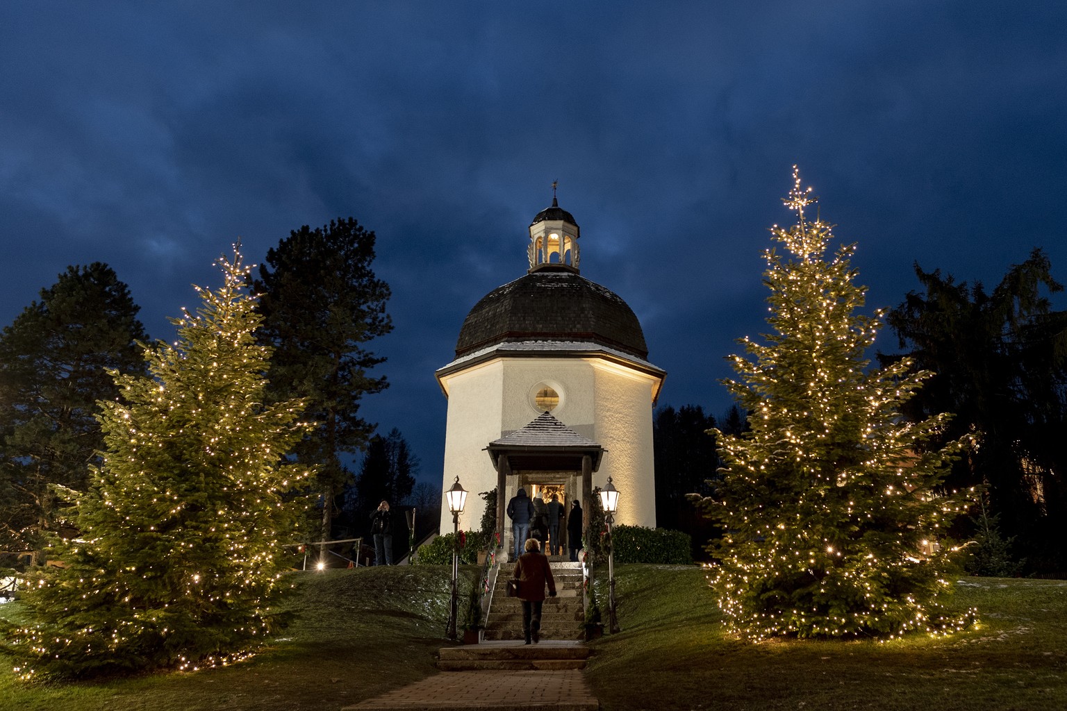 epa07236917 People walk up to at the Silent Night Chapel on the Silent Night Square in Oberndorf, some 20 kilometers northern Salzburg, Austria, 15 December 2018 (issued 17 December 2018). The famous  ...