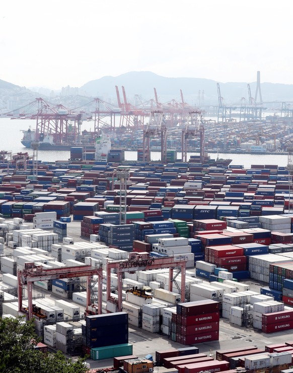 epa09387200 Containers are stacked up at a pier in Busan, South Korea, 02 August 2021. According to the South Korean trade ministry, the country&#039;s outbound shipments came in at 55.4 billion US do ...