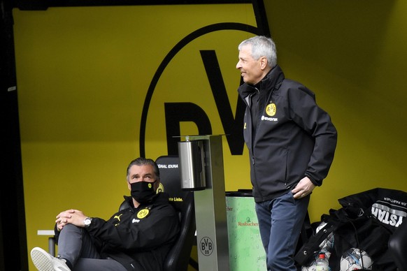Dortmund&#039;s head coach Lucien Favre stands by the bench during the German Bundesliga soccer match between Borussia Dortmund and Schalke 04 in Dortmund, Germany, Saturday, May 16, 2020. The German  ...