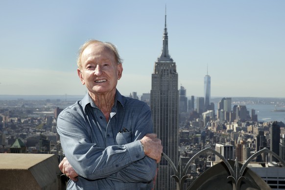 Former U.S. Open men&#039;s singles tennis champion Rod Laver poses for photos at the &quot;Top of the Rock,&quot; in New York&#039;s Rockefeller Center, Monday, Sept. 12, 2016. (AP Photo/Richard Drew ...
