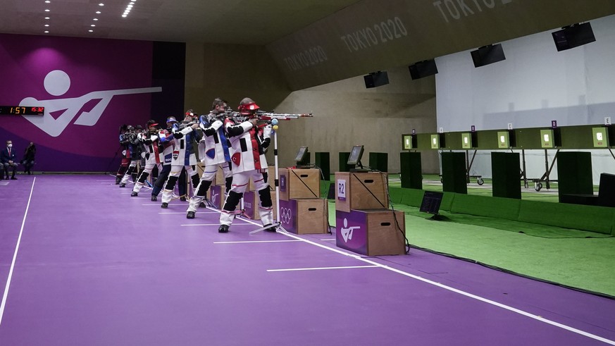 Athletes compete in the men&#039;s 10-meter air rifle at the Asaka Shooting Range in the 2020 Summer Olympics, Sunday, July 25, 2021, in Tokyo, Japan. (AP Photo/Alex Brandon)