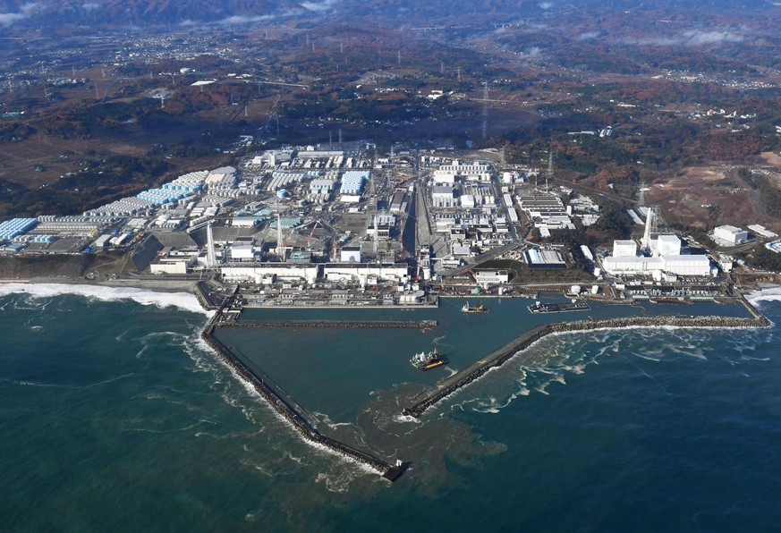 FILE - This Nov. 22, 2016, aerial file photo shows Fukushima Dai-ichi nuclear power plant in Okuma, Fukushima prefecture, Japan. A suspected wartime bomb was dug up at Thursday, Aug. 10, 2017, a const ...