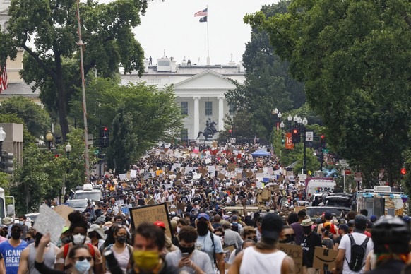 FILE - In this Saturday, June 6, 2020 file photo, demonstrators gather near the White House in Washington, to protest the death of George Floyd, a black man who was in police custody in Minneapolis. P ...