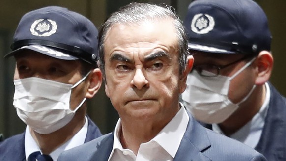FILE - In this April 25, 2019, file photo, former Nissan Chairman Carlos Ghosn leaves Tokyo&#039;s Detention Center for bail in Tokyo. By jumping bail, Ghosn, who had long insisted on his innocence, h ...