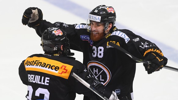 LuganoÕs player Sebastien Reuille and LuganoÕs player Raffaele Sannitz celebrate the 4-2 goal, during the fourth match the semifinal of National League Swiss Championship 2017/18 between HC Lugano and ...