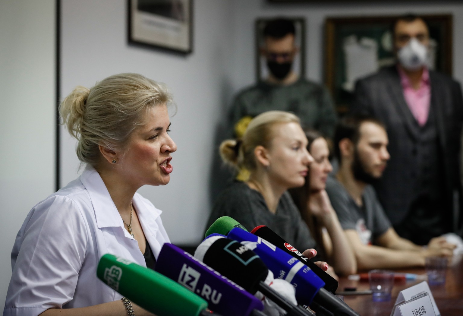 epa08546979 (At the table L-R) Elena Smolyarchuk, chief researcher, Head of the Center for Clinical Research on Medications at Sechenov University, speaks as volunteers on whom the Russian vaccine aga ...