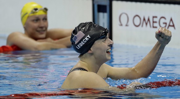 United States&#039; Katie Ledecky celebrates winning the gold medal in the women&#039;s 200-meter freestyle ahead of second placed Sweden&#039;s Sarah Sjostrom, left, during the swimming competitions  ...