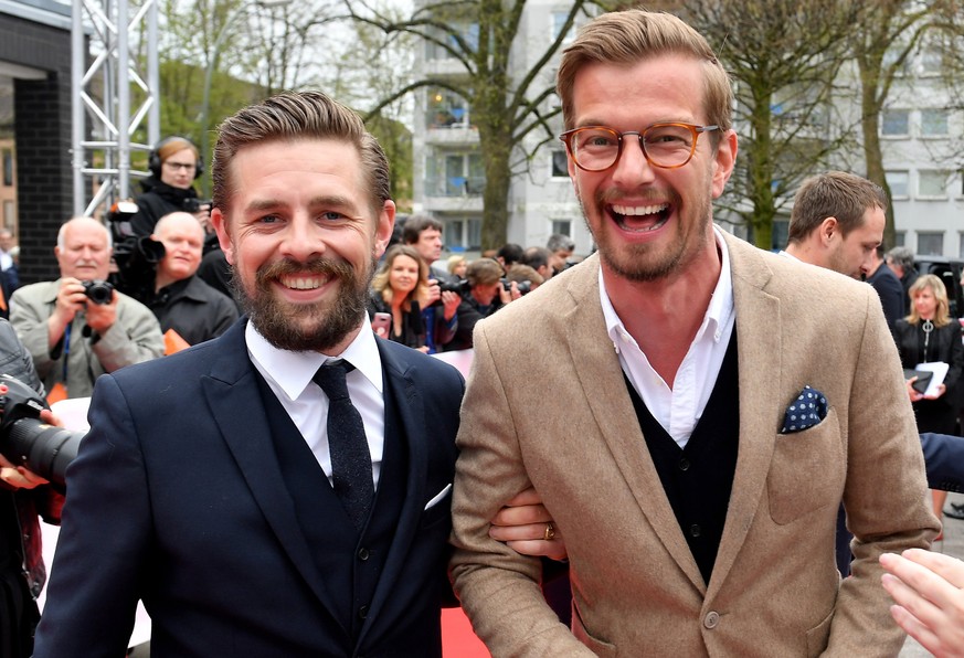 epa06667306 German TV hosts Klaas Heufer-Umlauf (L) and Joko Winterscheidt (R) arrive for the 54th Grimme Award ceremony in Marl, Germany, 13 April 2018. The prize is a German television award given i ...