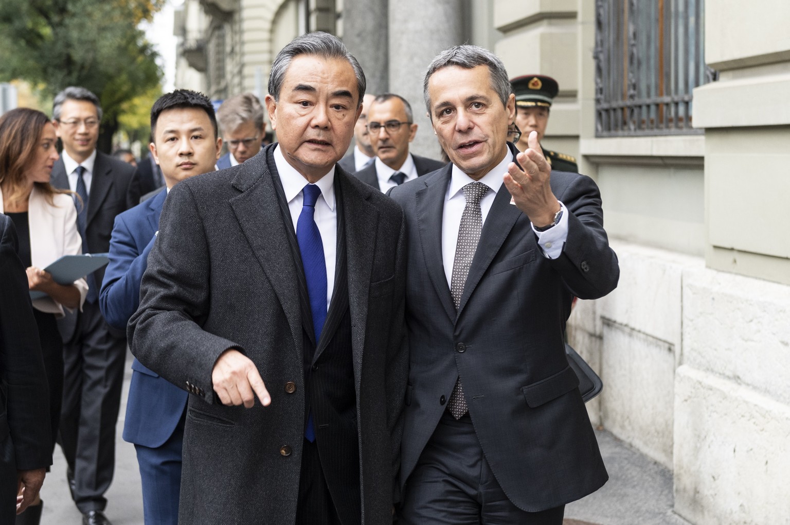 Swiss Foreign minister, Federal Councillor Ignazio Cassis, right, walks to a joint press conference with his guest Wang Yi, Foreign Minister of the PeopleÕs Republic of China, staying on an official w ...