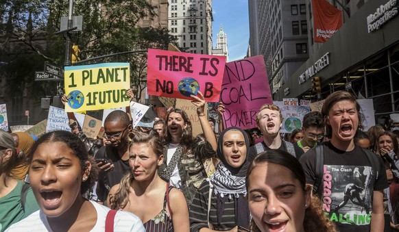 FILE - In this Friday Sept. 20, 2019 file photo, climate change activists participate in an environmental demonstration as part of a global youth-led day of action in New York, as a wave of climate ch ...