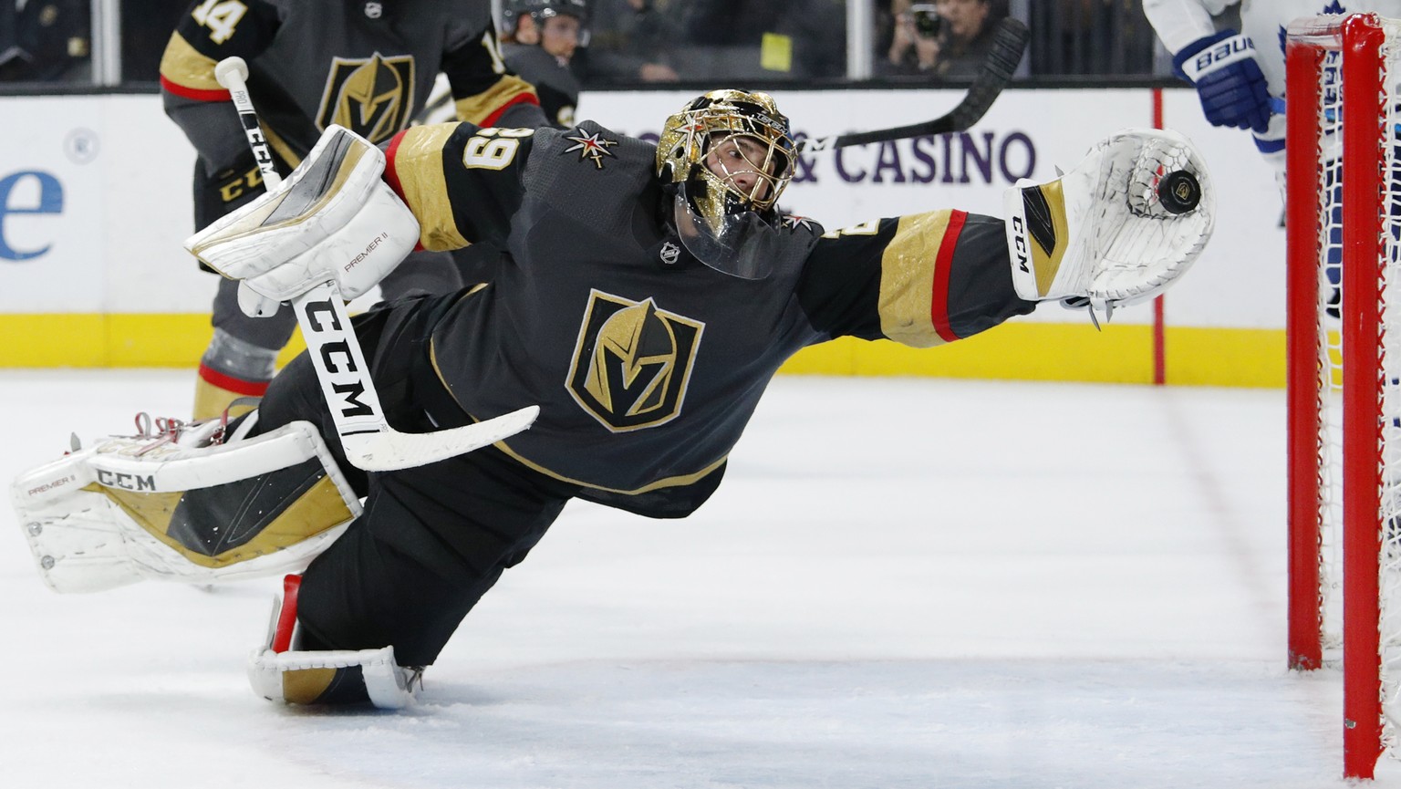 Vegas Golden Knights goaltender Marc-Andre Fleury (29) dives to make a glove save against the Toronto Maple Leafs during the third period of an NHL hockey game Tuesday, Nov. 19, 2019, in Las Vegas. (A ...