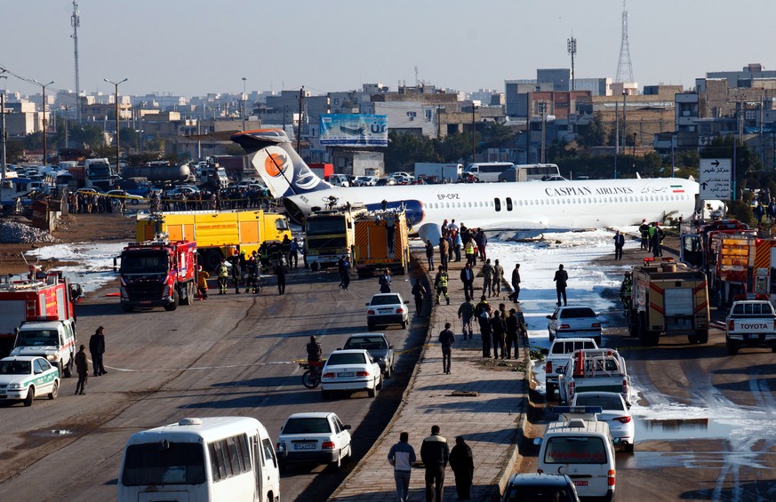 epa08169273 An Iranian passenger plane sits on a highway outside Mahshahr airport after skidding off the runway, in the southwestern city of Mahshahr, Iran, 27 January 2020. According to media reports ...