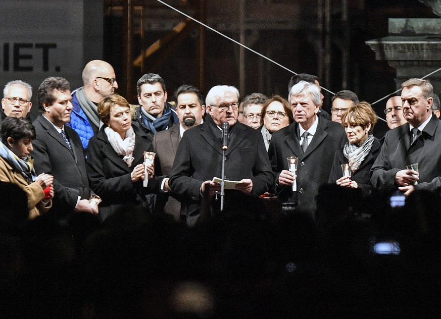 German president Frank-Walter Steinmeier holds a speech in front of thousands on the market placduring a mourning for the victims of the shooting in Hanau, Germany, Thursday, Feb. 20, 2020. A 43-year- ...