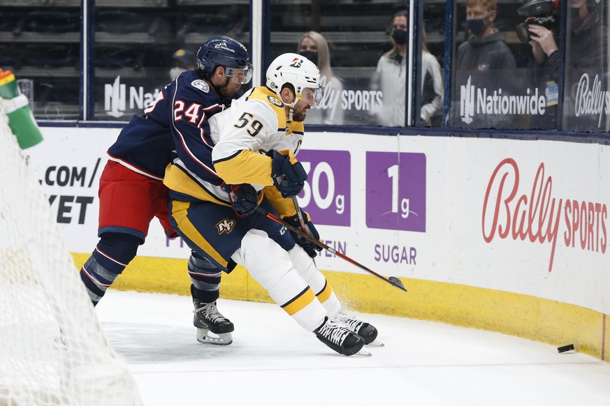 Columbus Blue Jackets&#039; Nathan Gerbe, left, and Nashville Predators&#039; Roman Josi chase the puck during the second period of an NHL hockey game Wednesday, May 5, 2021, in Columbus, Ohio. (AP Ph ...