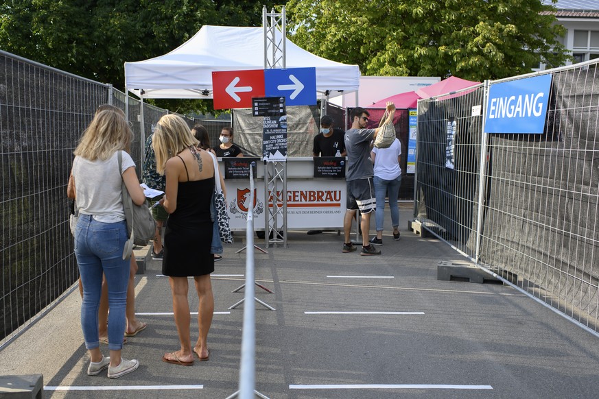Festival-goers are waiting in front of the separate entrance in two parts, at the ?Swiss Mountain Roadshow?, during the coronavirus disease (COVID-19) outbreak, in Steffisburg, Switzerland, Thursday,  ...