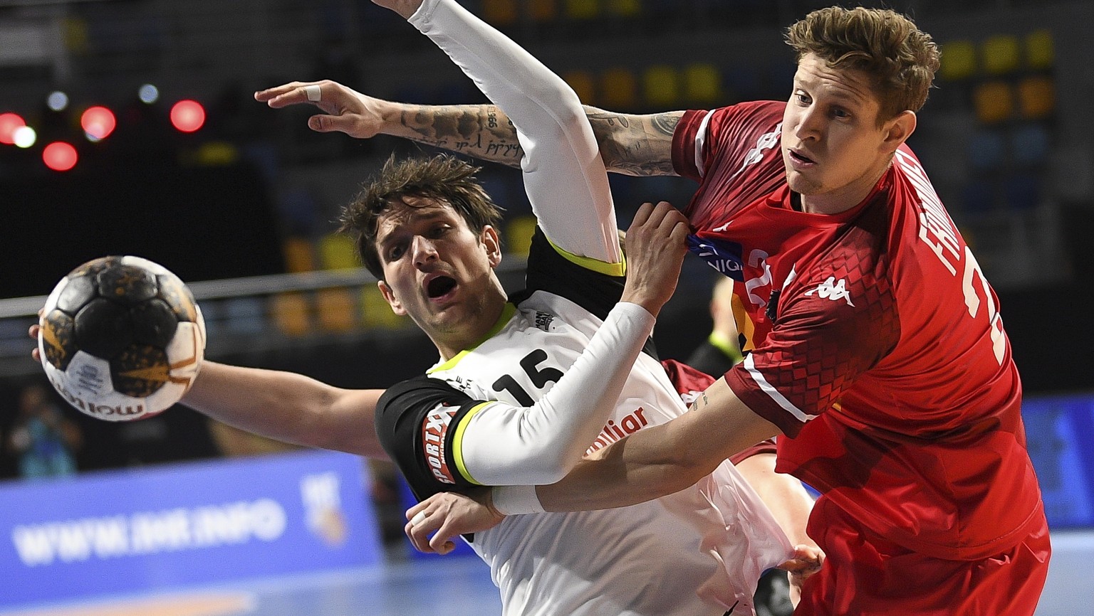 epa08937797 Switzerland&#039;s Nicolas Raemy (L) in action against Austria&#039;s Sebastian Frimmel (R) during the match between Austria and Switzerland at the 27th Men&#039;s Handball World Champions ...