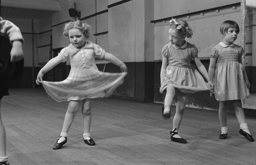 Three and a half year-old Linda Ball (left) with other young pupils in a dance class at the Italia Conti Academy, a stage school in London, June 1952. Original Publication: Picture Post - 5883 - A Nur ...