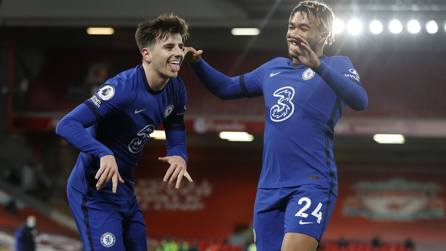 Chelsea&#039;s Mason Mount, left, celebrates with his teammate Reece James after scoring his side&#039;s opening goal during the English Premier League soccer match between Liverpool and Chelsea at An ...