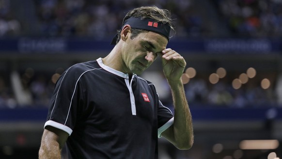 Roger Federer, of Switzerland, reacts during a match against Grigor Dimitrov, of Bulgaria, during the quarterfinals of the U.S. Open tennis tournament Tuesday, Sept. 3, 2019, in New York. (AP Photo/Se ...