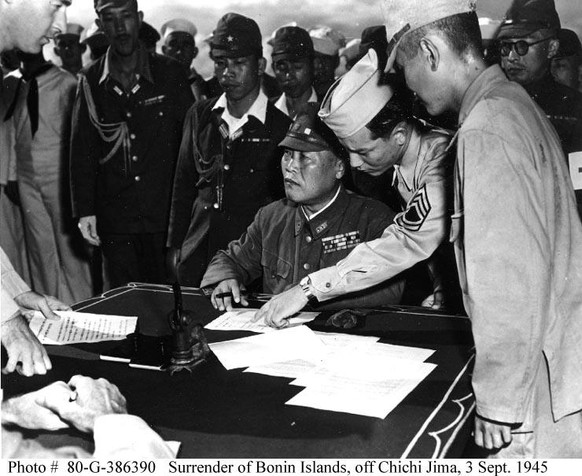 Lieutenant General Yoshio Tachibana, Japanese Army, prepares to sign documents surrendering the Bonin Islands, 3 September 1945, off Chichi Jima, on board USS Dunlap (DD-384).
https://en.wikipedia.org ...