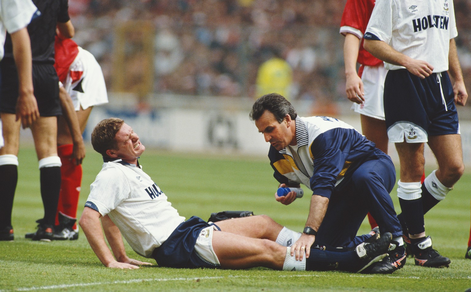 LONDON, UNITED KINGDOM - MAY 18: Tottenham Hotspur player Paul Gascoigne receives treatment before being stretchered off after commiting a foul on Nottingham Forest player Gary Charles during the FA C ...