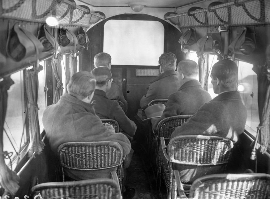 Passengers on a German airline watching the first ever in-flight film. (Photo by E Bacon/Getty Images)