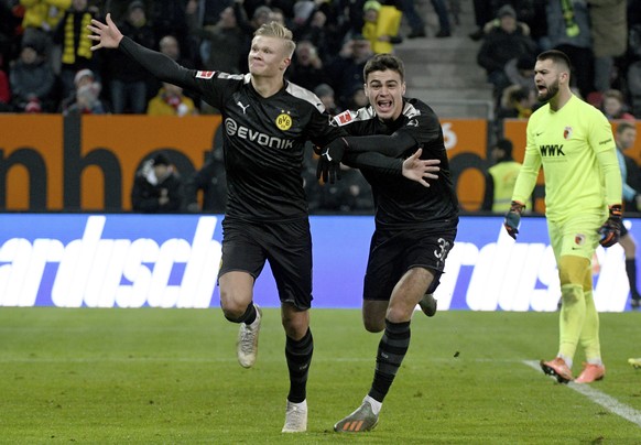 Dortmund&#039;s Erling Haaland, left, celebrates with Giovanni Reyna after scoring a goal in a German Bundesliga soccer match between FC Augsburg and Borussia Dortmund in Augsburg, Germany, Saturday,  ...