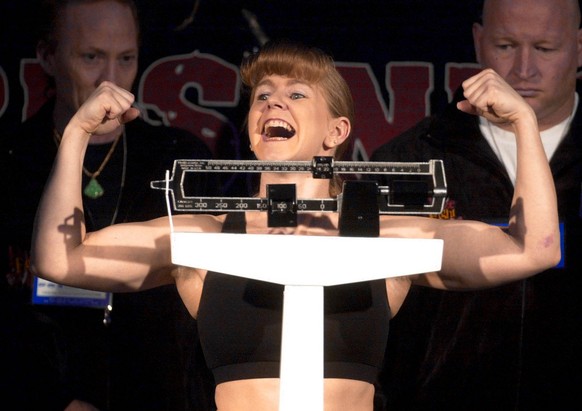 ADVANCE FOR USE MONDAY, DEC. 23 - FILE - In this Feb. 21, 2003, file photo, Former Olympic figure skater Tonya Harding poses during the weigh-in for her bantamweight fight against Samantha Browning in ...