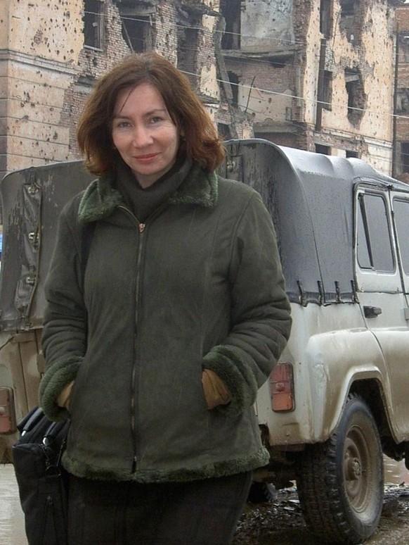 epa01796275 An undated handout photograph distributed by Russian human rights organization Memorial, showing the journalist and human right activist Natalia Estemirova at the building with the bullet  ...