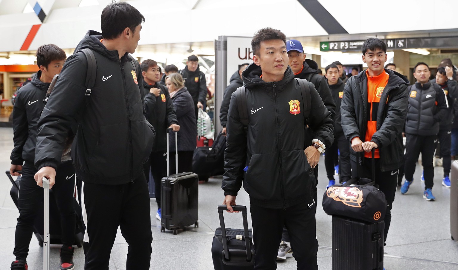Players of the Chinese Super League team Wuhan Zall arrive at the Atocha train station in Madrid, Spain, Saturday, Feb. 29, 2020. The Chinese first-division soccer club from the city of Wuhan enters i ...