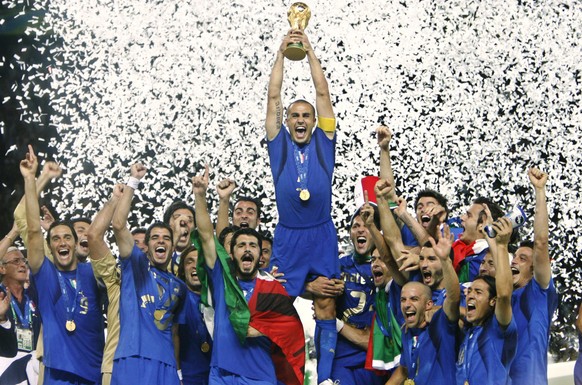 Italy&#039;s Fabio Cannavaro lifts the trophy after defeating France 5-3 in a shootout in the final of the soccer World Cup between Italy and France in the Olympic Stadium in Berlin, Sunday, July 9, 2 ...