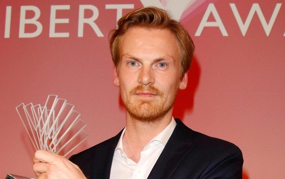 epa07241842 German journalist Claas Relotius holds his award trophy of the Reemtsma Liberty Award, a German journalist award, in Berlin, Germany, 22 March 2017 (issued 20 December 2018). German weekly ...