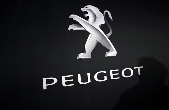 In this March 1, 2018 photo, the logo of Peugeot is displayed at PSA Peugeot Citroen headquarters during the presentation of the company&#039;s 2017 full year results, in Rueil-Malmaison, west of Pari ...